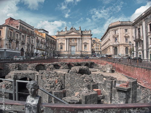 Shot of the Roman Anphitheater in Piazza Stesicoro in Catania in a summer day. Catania, Sicily photo