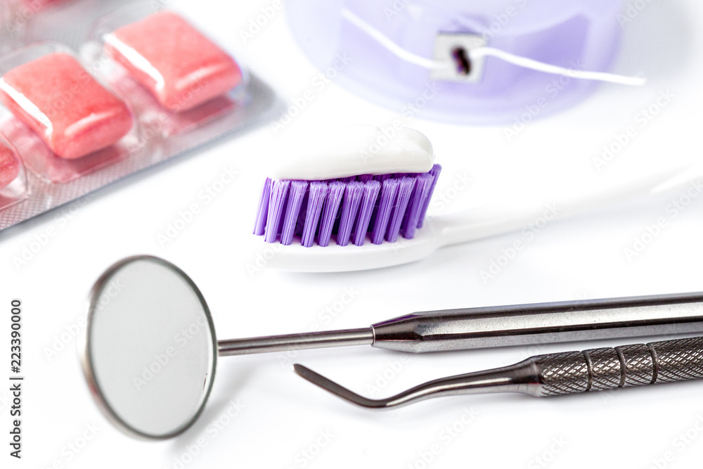 dental care toothbrush with dentist tools on white background dental care toothbrush with dentist tools on white background