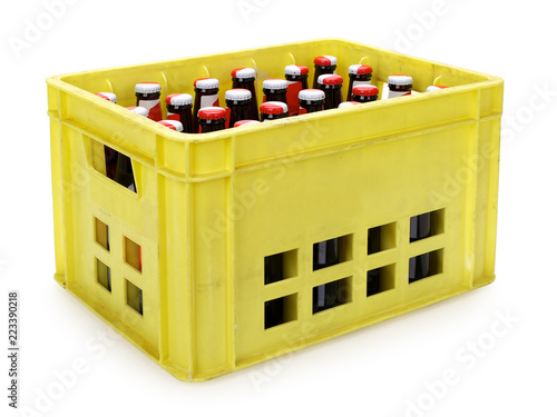 Yellow beer crate with bottles on white, contains clipping path