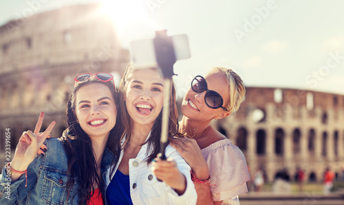 Photography summer vacation, holidays, travel, technology and people concept- group of smili