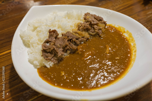 Japanese curry with rice topped with beef and onion simmered in a mildly sweet sauce flavored 