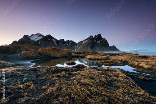 Magical Vestrahorn Mountains and Beach in Iceland at sunrise. Panoramic view of an Icelandic amazing landscape.