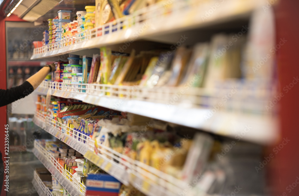Blurred of product shelves in supermarket or grocery store