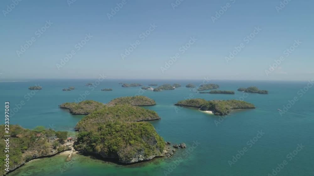 Aerial view of Small islands with beaches and lagoons in Hundred Islands National Park, Pangasinan, Philippines. Famous tourist attraction, Alaminos. Aerial view of Small islands with beaches and lagoons in Hundred Islands National Park, Pangasinan, Philippines. Famous tourist attraction, Alaminos.