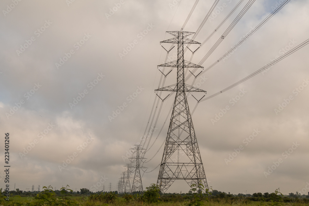 High voltage power on sky and cloud background.Transmission line tower.