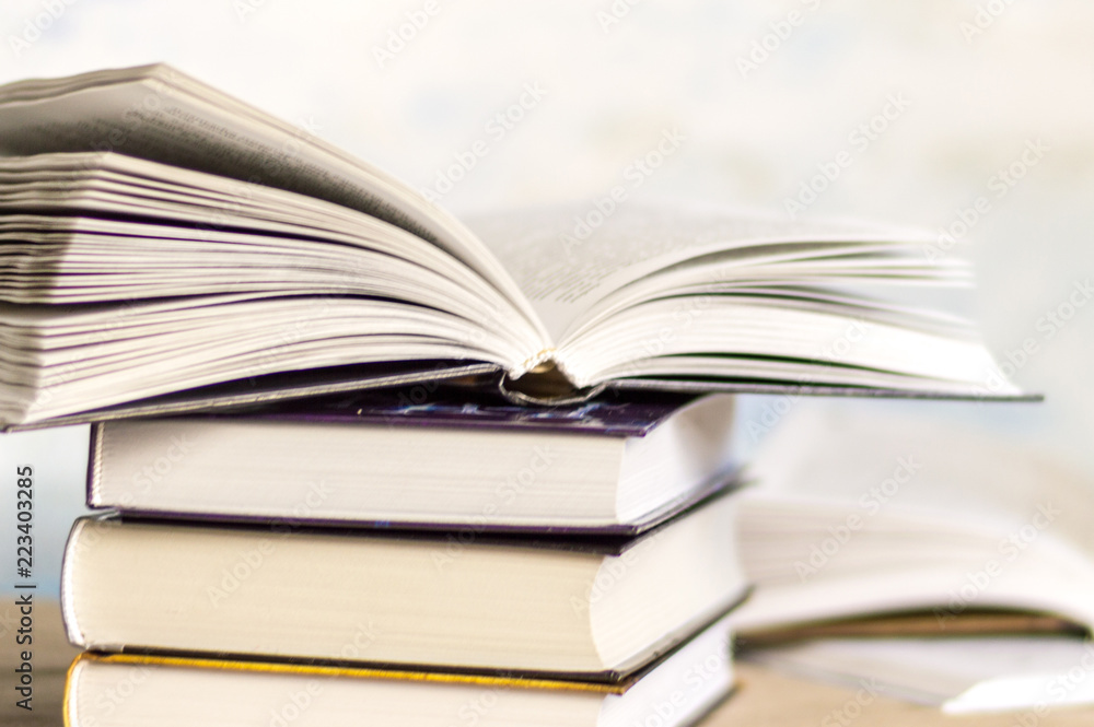 Open book on book stack Open book on book stack
