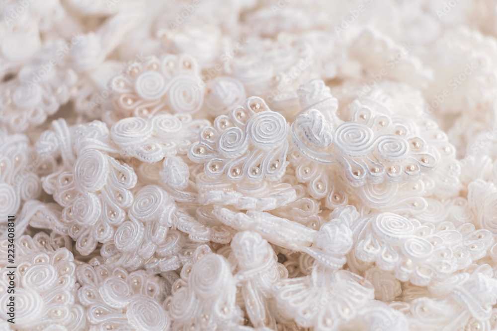 Button knot chinese : A lot of traditional chinese white knot buttons on the white background. Button knot chinese : A lot of traditional chinese white knot buttons on the white background.