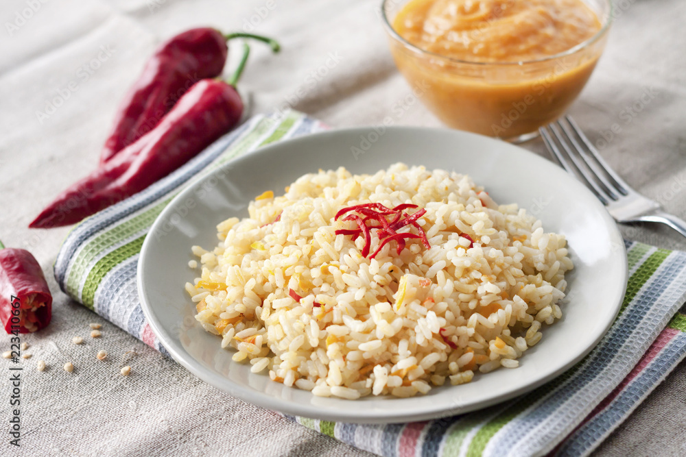 Spicy parboiled rice with carrots, yellow zucchini and chilli peppers Spicy parboiled rice with carrots, yellow zucchini and chilli peppers