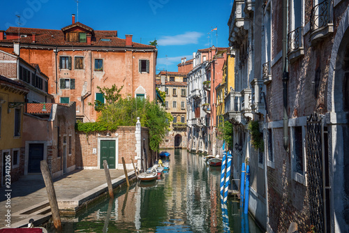 Traditional canal street and colorful Venetian houses in Venice, Italy.