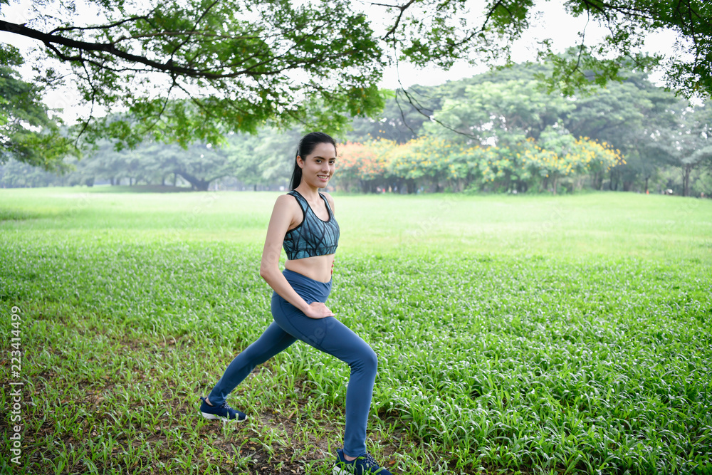 Exercise concept. Beautiful girl is stretching her muscles. Beautiful girls are warming up before running. Exercise concept. Beautiful girl is stretching her muscles. Beautiful girls are warming up before running.