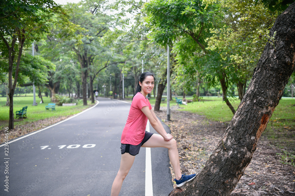 Exercise concept. Beautiful girl is stretching her muscles. Beautiful girls are warming up before running. Exercise concept. Beautiful girl is stretching her muscles. Beautiful girls are warming up before running.