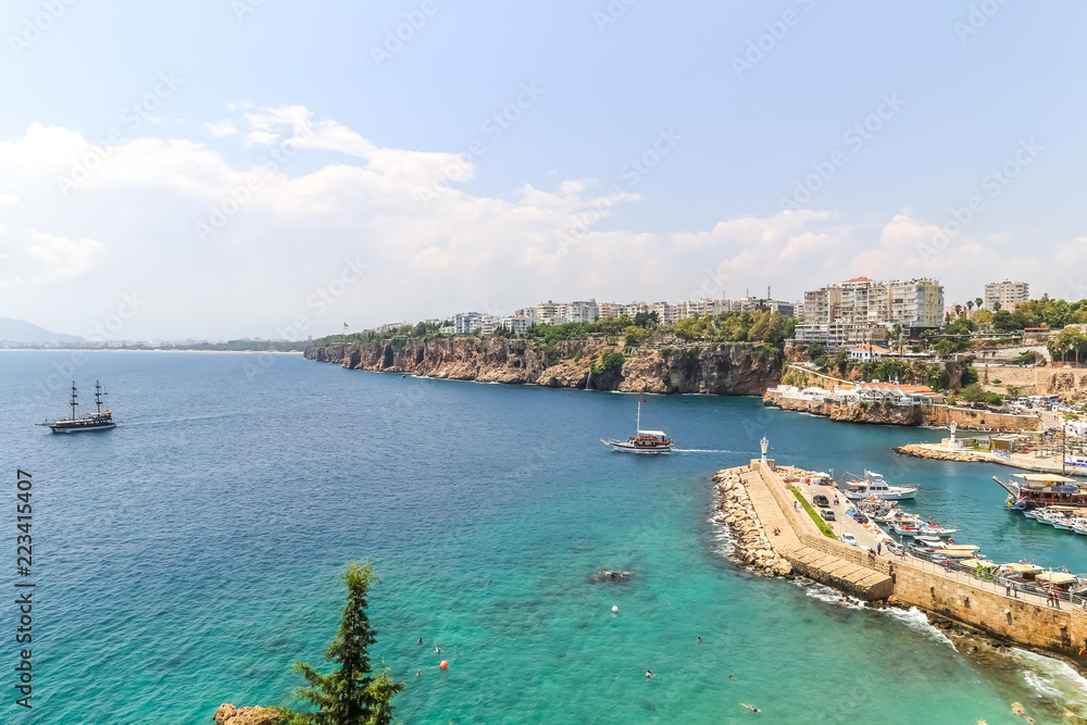 travel background with old harbour in Antalya