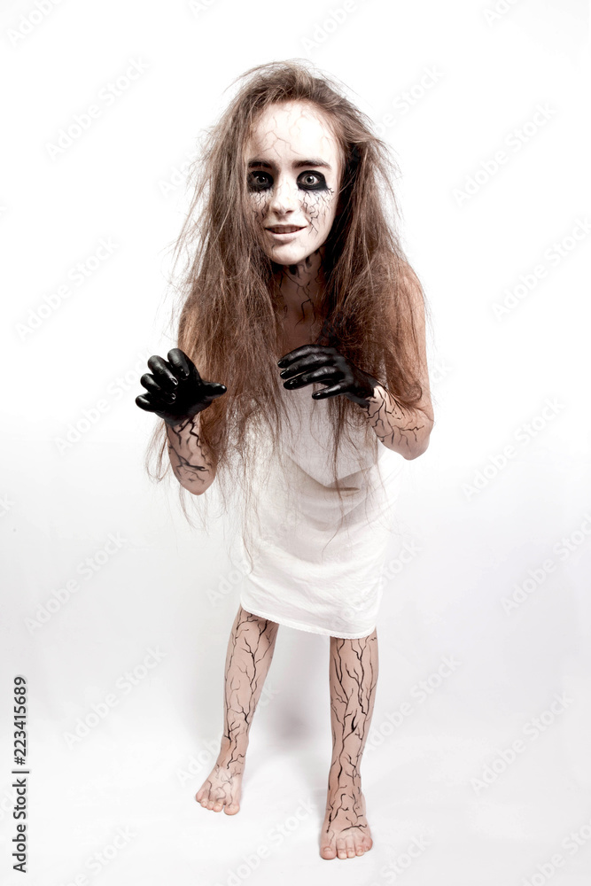 crazy girl with disheveled hair, black eyes and veins. concept of halloween and day of the dead. crazy girl with disheveled hair, black eyes and veins. concept of halloween and day of the dead.