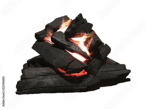 Burning coal in a barbecue pit - Isolated on white
