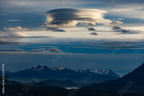 Lenticular clouds over the Andes taken from Torres del Paine, Patagonia, Chile at sunset in twilight.