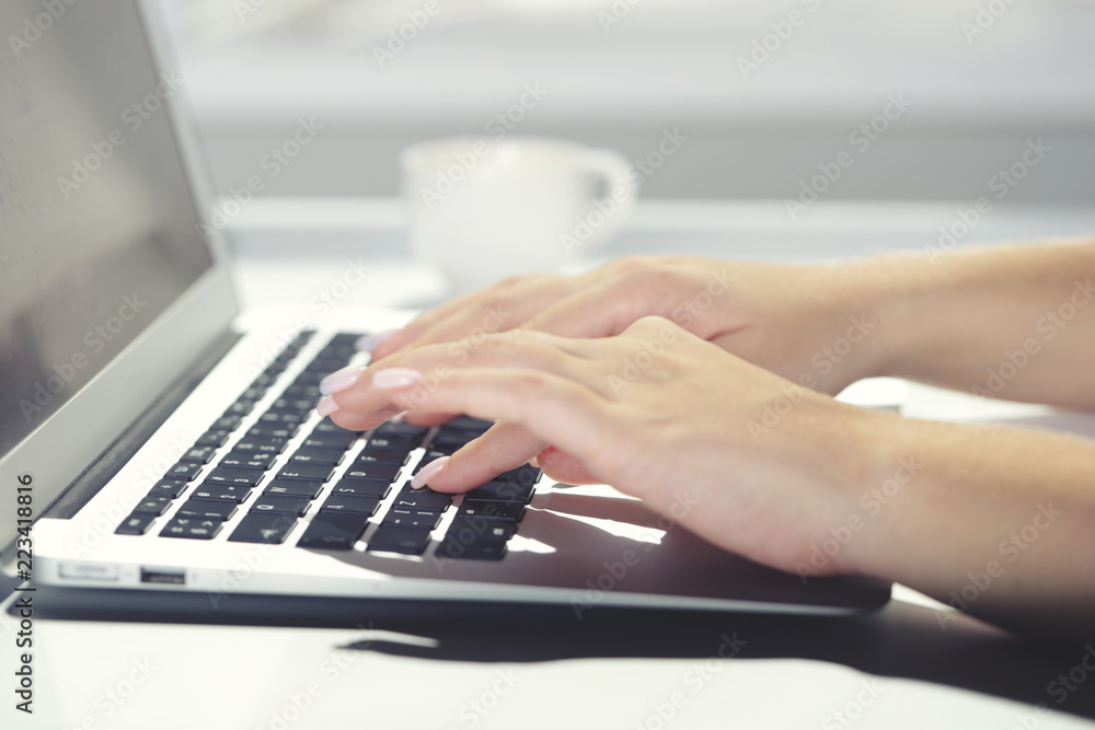 Woman typing on laptop at workplace Woman working in home office hand keyboard Woman typing on laptop at workplace Woman working in home office hand keyboard