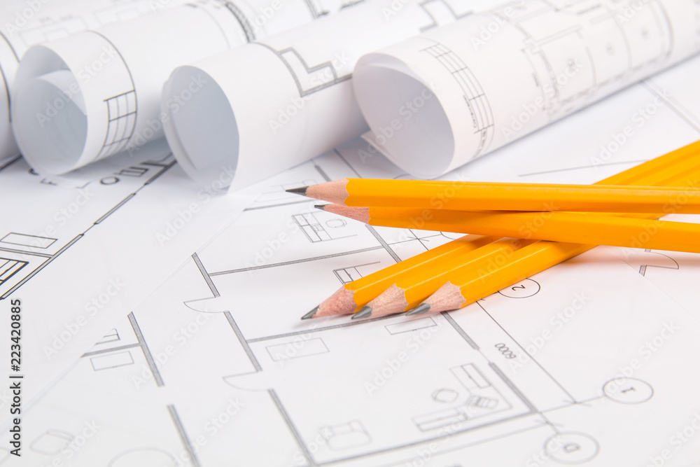 Pencils and paper еngineering house drawings and blueprints. Pencils and paper еngineering house drawings and blueprints.