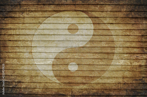 Chinese yin yang sign on a background of old boards
