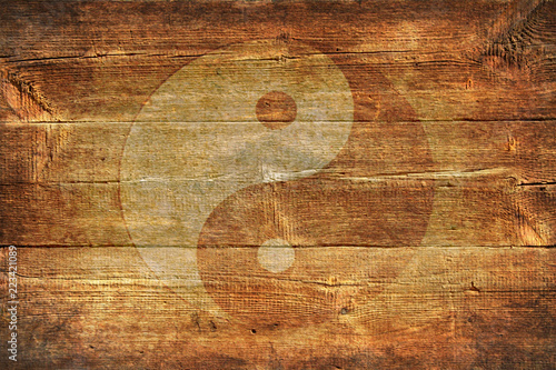 Chinese yin yang sign on a background of old boards