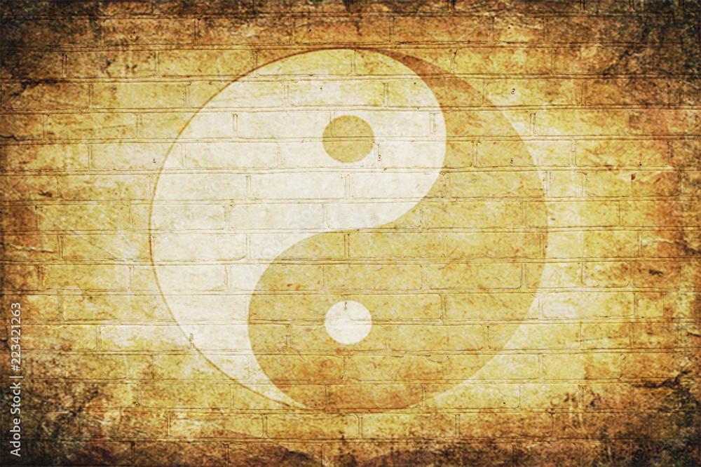 Chinese yin yang sign on an old brick wall