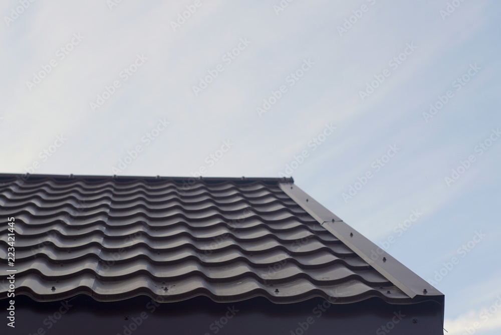 Modern Roof Covered With Tile Effect Pvc Coated Brown Metal Roof Sheets. Modern Roof Covered With Tile Effect Pvc Coated Brown Metal Roof Sheets.