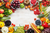 Healthy living, summer fruits vegetables berries arranged in a frame. Organic produce, raw eating, copy space, top view, selective focus