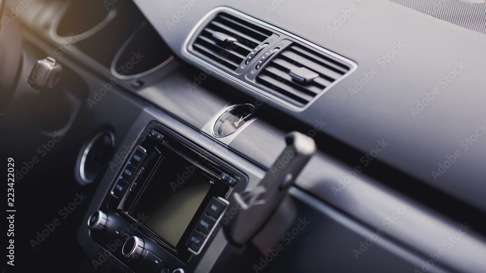 Car air conditioning. The air flow inside the car. Detail audio system buttons in car.