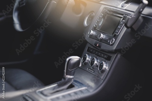 luxury car Interior - steering wheel, shift lever and dashboard. 