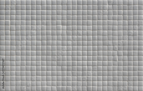 Wall covered in small white tiles texture