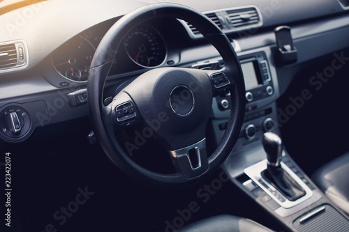 luxury car Interior - steering wheel  shift lever and dashboard. 