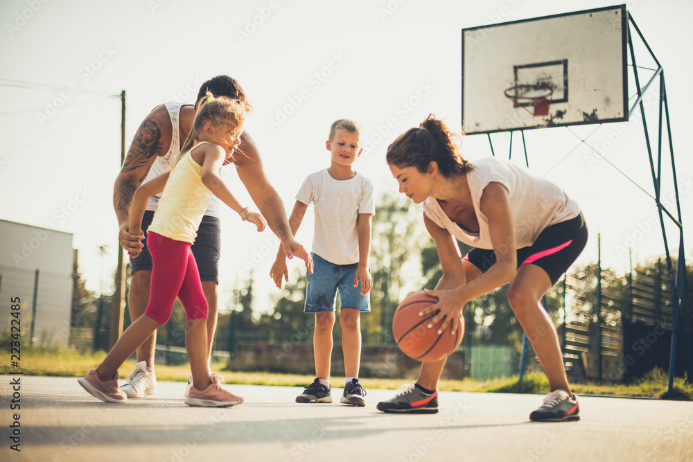 Family playing basketball together. Stock Photo | Adobe Stock