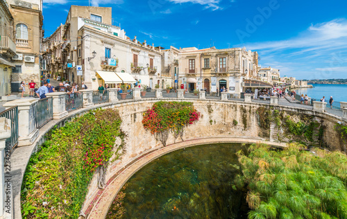 The Fountain of Arethusa and Siracusa (Syracuse) in a sunny summer day. Sicily, Italy. photo