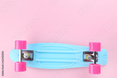 Skateboard on pink background