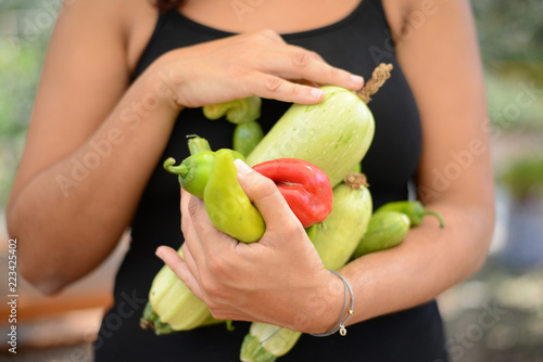 Medley of vegetables a woman is holding in her hands