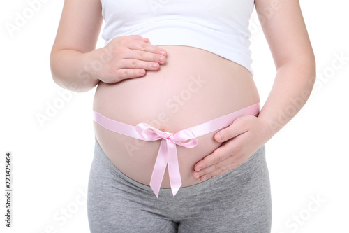 Pregnant woman with pink ribbon on white background © 5second