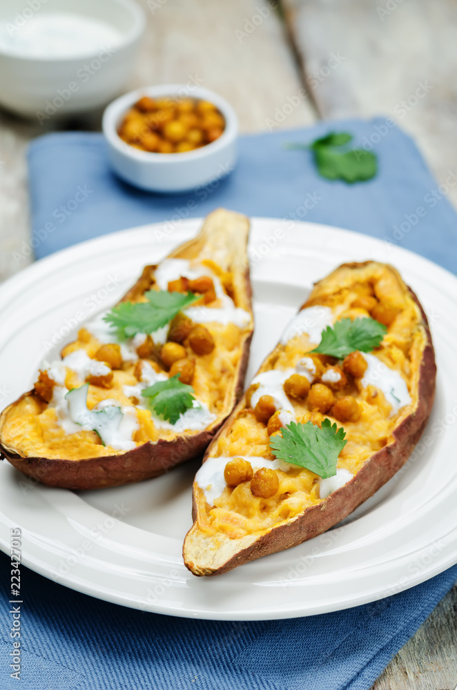 Roasted chickpeas stuffed sweet potato with Greek yogurt cilantro lime dressing