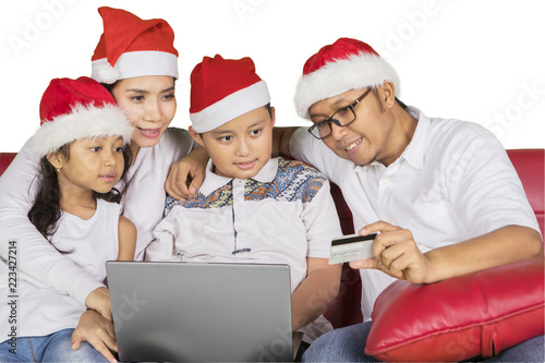 Happy family shopping online at Christmas time