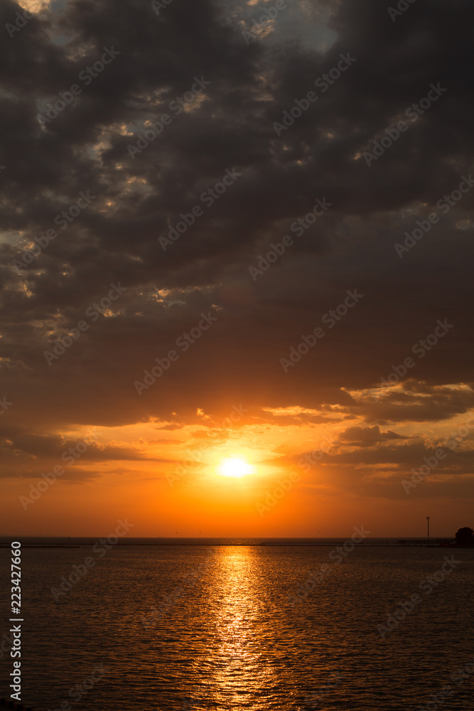 dawn overlooking the sea and the horizon in the summer in the port of Odessa dawn overlooking the sea and the horizon in the summer in the port of Odessa