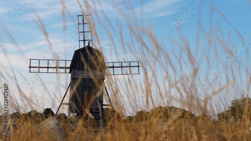 swedish windmill with a grainfield in the front