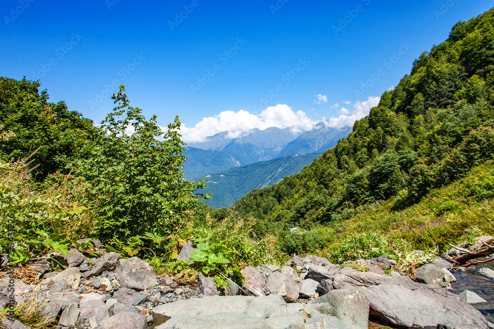 Tourism vacation and travel. Mountains landscape at summer and mountain tops in the background