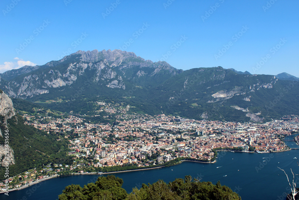Mount Resegone and city of Lecco (northern Italy) aerial view between mountains and lake in summer