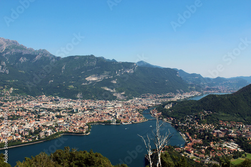 Aerial view of Lecco city between mountains lake and Adda river in northern Italy