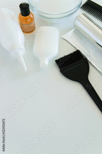 Hair dye tools on white background  space for text
