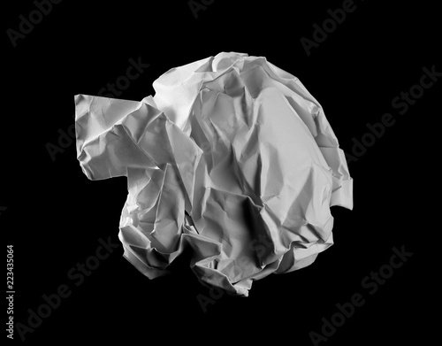 Crumpled white paper ball isolated on black with clipping path