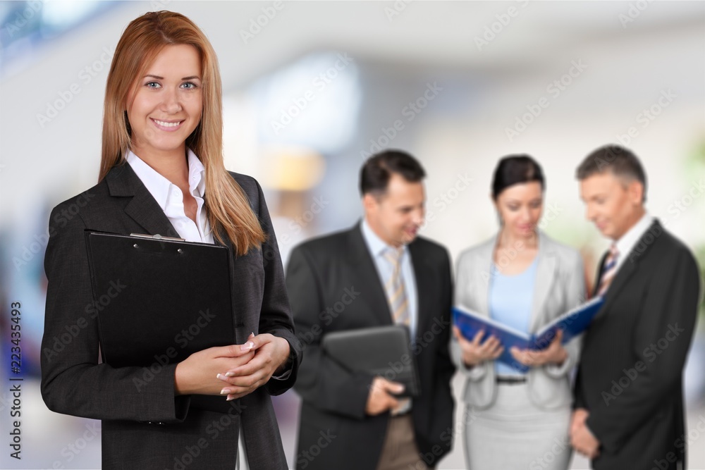 Group of confident businesspeople at meeting Group of confident businesspeople at meeting