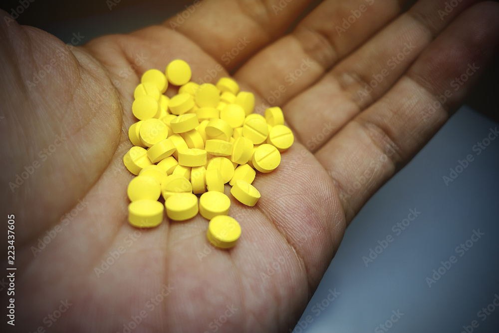 Yellow pills emptied from the bottle Yellow pills emptied from the bottle