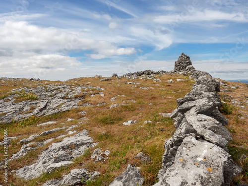 Dry stone fence and tower,  rocks in Burren national park, county Clare, Ireland. © mark_gusev