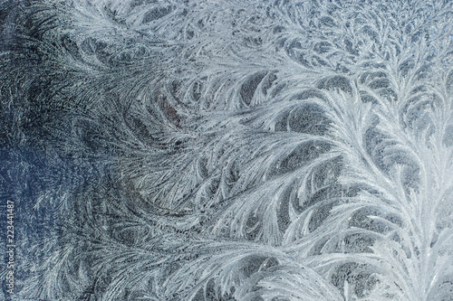 Frosty glass ice background, natural beautiful snowflakes. Frost ice pattern. Winter Christmas abstract backdrop.