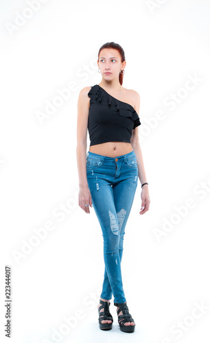 girl in jeans on a light background