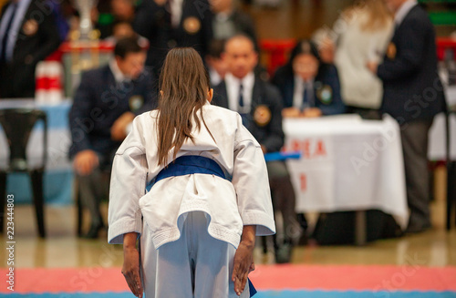 girl karatek preparing to make kata at the championship